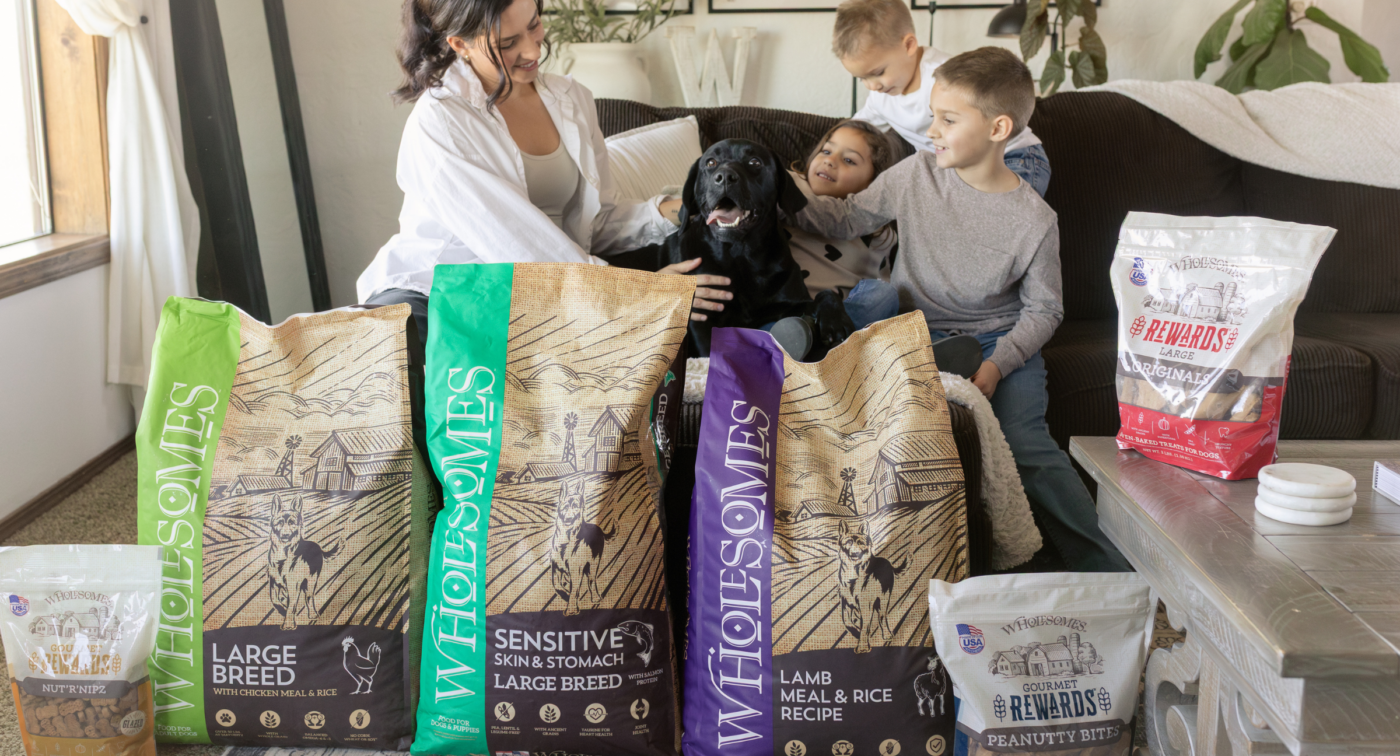 family with their dog and large breed, sensitive, and treats 